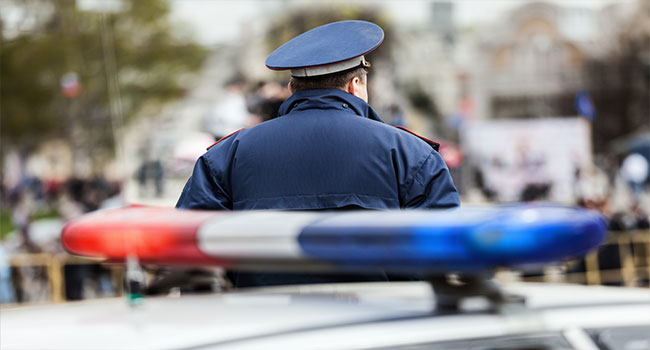 Police car siren and cop